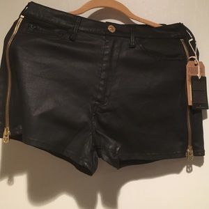 True Religion shorts with gold zipper details.